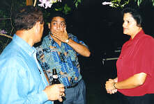 Tony Leo (left) telling a fantastic (?) story to Derek Richards (whoops) with wife Linda.